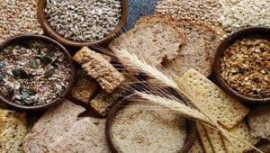 a variety of wheats and grains in various bowls 