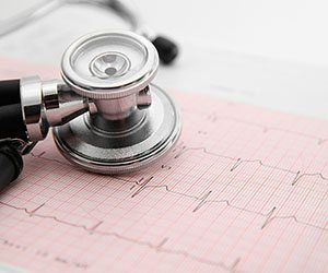 Stethoscope atop medical papers