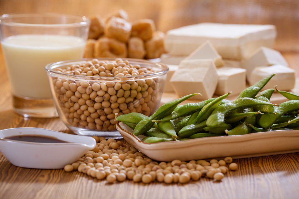 a variety of soy foods, including: soybeans, edamame, soy sauce, tofu, tempeh, soy milk