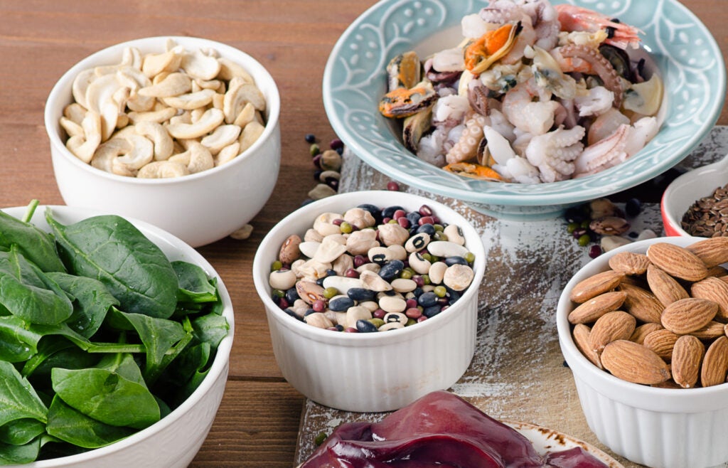 Foods high in manganese including spinach, legumes, nuts, shellfish